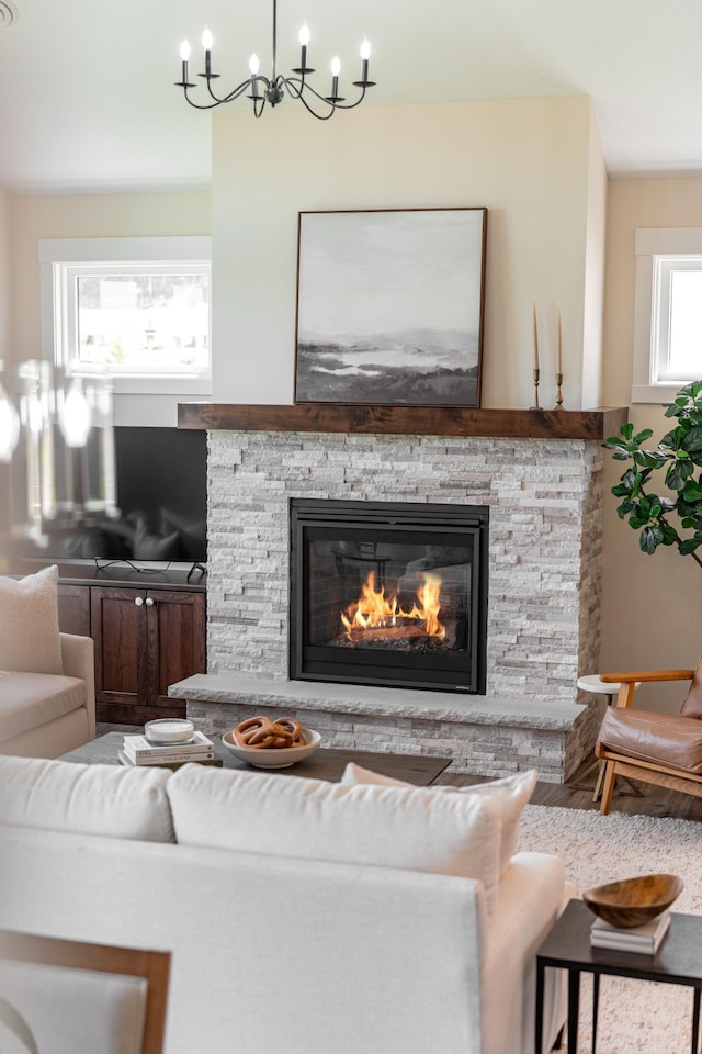 2461 Sharon Ln, Hudson, WI 54016 - living room featuring a fireplace and a chandelier