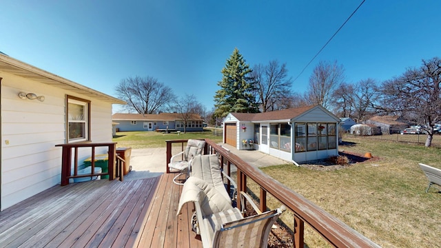 715 3rd Ave, Albert Lea, MN 56007 - wooden terrace featuring a sunroom, a yard, and an outdoor structure