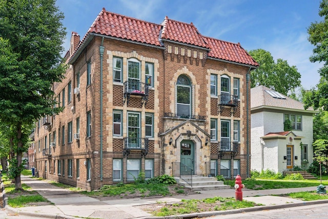 3252 Fremont Ave S Unit 102, Minneapolis, MN 55408 - view of front of property featuring a tiled roof and brick siding