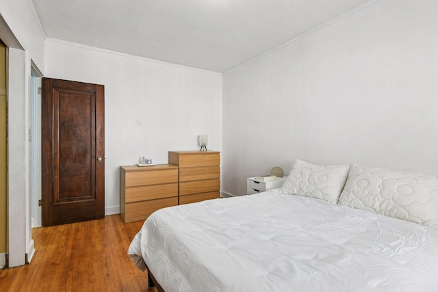 3252 Fremont Ave S Unit 102, Minneapolis, MN 55408 - bedroom featuring ornamental molding and wood finished floors
