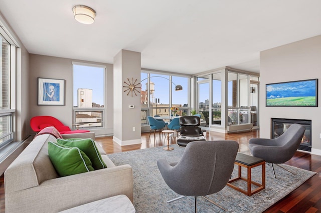 222 2nd St SE Unit 1503, Minneapolis, MN 55414 - living room featuring a glass covered fireplace and wood finished floors