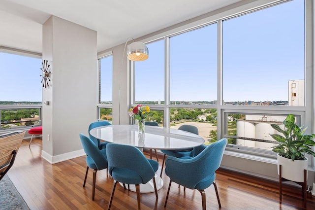 222 2nd St SE Unit 1503, Minneapolis, MN 55414 - dining space featuring healthy amount of natural light and wood finished floors