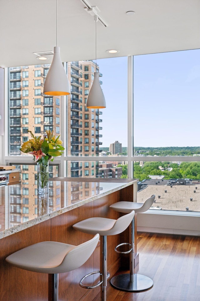 222 2nd St SE Unit 1503, Minneapolis, MN 55414 - dining space with a city view and wood finished floors