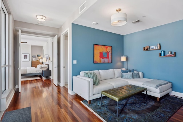 222 2nd St SE Unit 1503, Minneapolis, MN 55414 - living area featuring dark wood-type flooring and baseboards