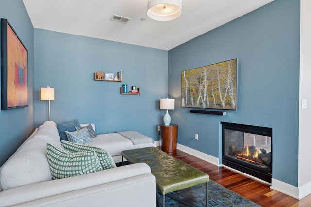 222 2nd St SE Unit 1503, Minneapolis, MN 55414 - living room with wood finished floors and a glass covered fireplace