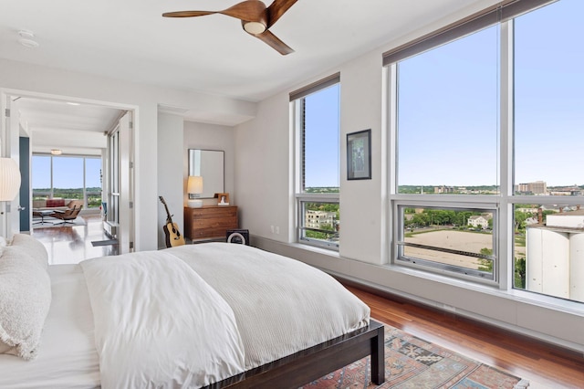 222 2nd St SE Unit 1503, Minneapolis, MN 55414 - bedroom featuring wood finished floors and ceiling fan