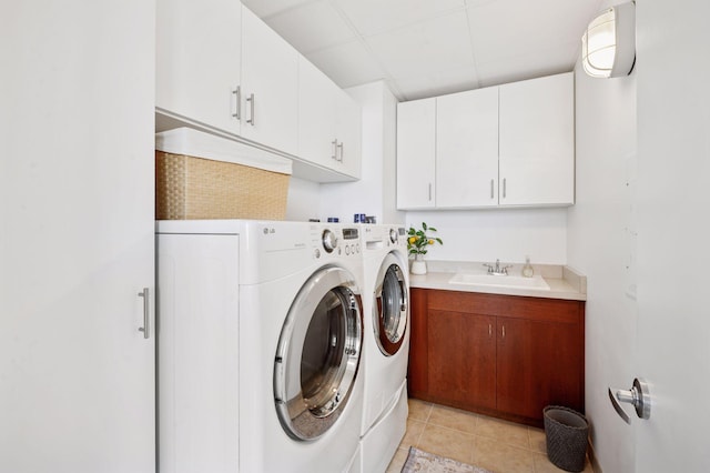 222 2nd St SE Unit 1503, Minneapolis, MN 55414 - laundry room featuring washer and dryer, cabinet space, and light tile patterned floors