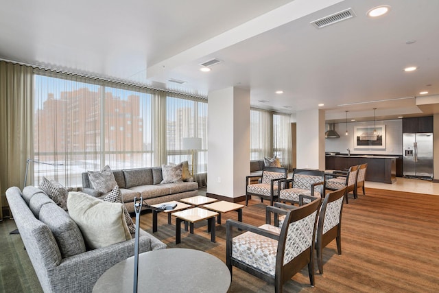 222 2nd St SE Unit 1503, Minneapolis, MN 55414 - living area featuring wood finished floors and recessed lighting