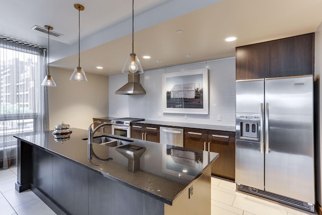 222 2nd St SE Unit 1503, Minneapolis, MN 55414 - kitchen with appliances with stainless steel finishes, light tile patterned floors, decorative backsplash, dark brown cabinets, and recessed lighting