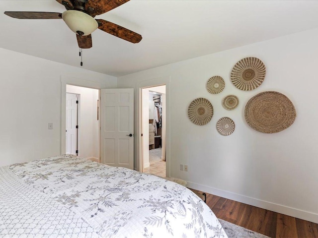 11034 Forest View Ct SW, Nisswa, MN 56468 - bedroom with wood finished floors, a spacious closet, and a ceiling fan