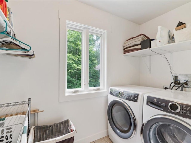 11034 Forest View Ct SW, Nisswa, MN 56468 - washroom featuring separate washer and dryer and light tile patterned flooring