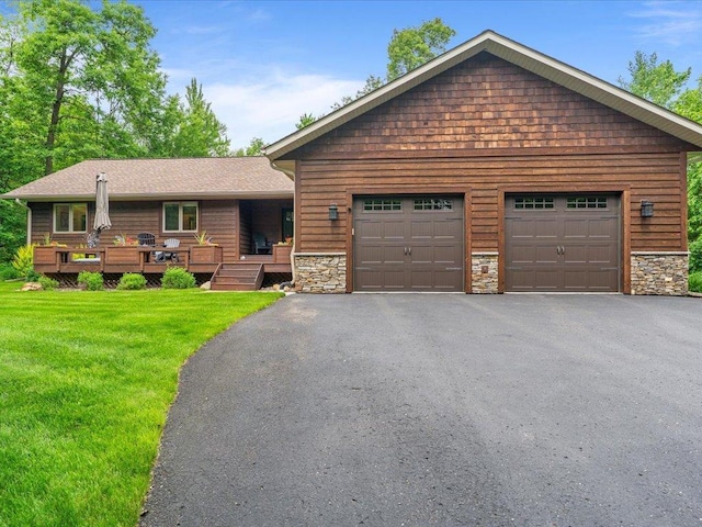 11034 Forest View Ct SW, Nisswa, MN 56468 - view of front of property with a front lawn, stone siding, and asphalt driveway