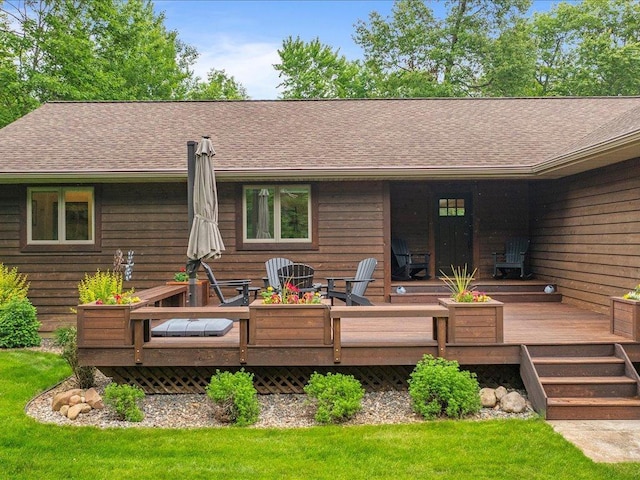 11034 Forest View Ct SW, Nisswa, MN 56468 - rear view of house featuring a deck, a shingled roof, and outdoor dining space