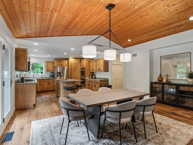11034 Forest View Ct SW, Nisswa, MN 56468 - dining room featuring lofted ceiling, wood ceiling, light wood-type flooring, and recessed lighting