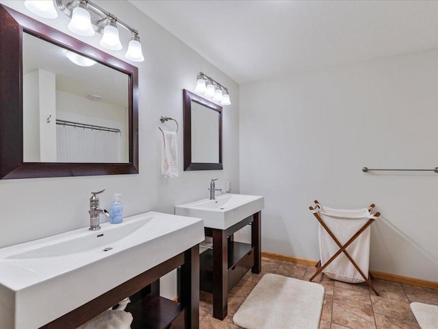 11034 Forest View Ct SW, Nisswa, MN 56468 - bathroom featuring two vanities and baseboards