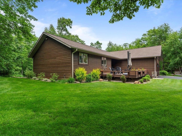 11034 Forest View Ct SW, Nisswa, MN 56468 - rear view of house with a wooden deck and a yard