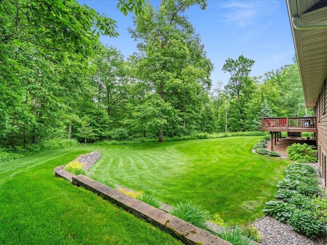 11034 Forest View Ct SW, Nisswa, MN 56468 - view of green lawn with a wooden deck