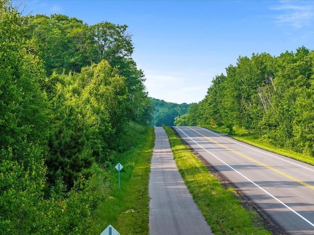 11034 Forest View Ct SW, Nisswa, MN 56468 - view of asphalt street with a wooded view