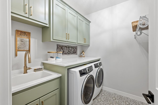 4452 167th Ave NW, Andover, MN 55304 - laundry area with cabinet space, washer and dryer, and tile patterned floors