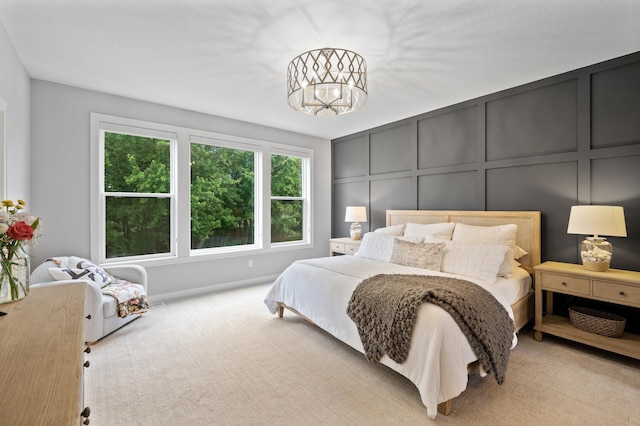4452 167th Ave NW, Andover, MN 55304 - carpeted bedroom featuring a decorative wall and a chandelier
