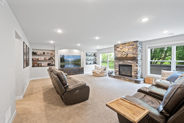 4452 167th Ave NW, Andover, MN 55304 - carpeted living area with a fireplace, recessed lighting, and built in shelves