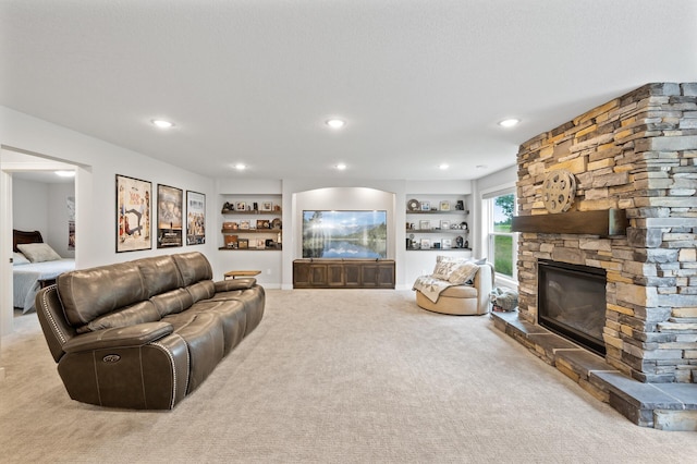 4452 167th Ave NW, Andover, MN 55304 - carpeted living room with a fireplace, built in features, and recessed lighting