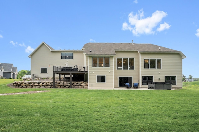 4452 167th Ave NW, Andover, MN 55304 - rear view of property with a hot tub, a patio, a lawn, and a deck