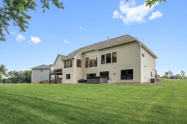 4452 167th Ave NW, Andover, MN 55304 - back of property featuring a hot tub, a yard, and a wooden deck