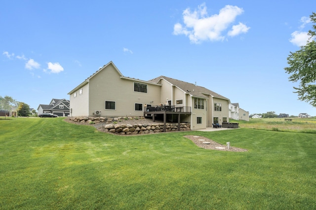 4452 167th Ave NW, Andover, MN 55304 - back of property featuring a lawn, a patio area, and a wooden deck