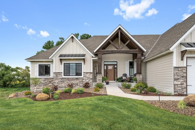 4452 167th Ave NW, Andover, MN 55304 - craftsman-style house featuring board and batten siding, a shingled roof, stone siding, and a front lawn