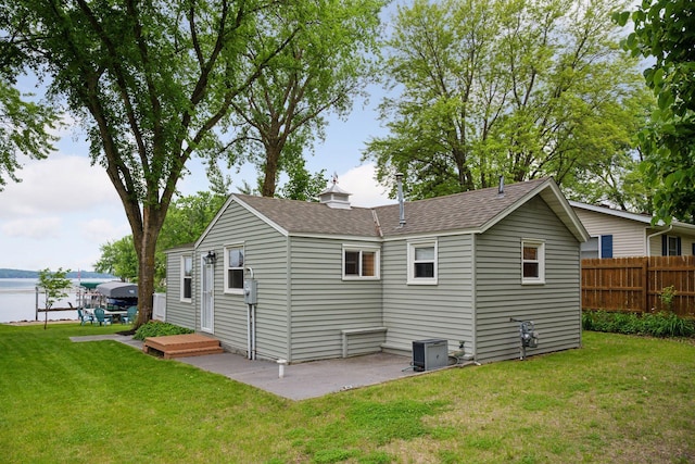 7315 120th St NW, Annandale, MN 55302 - back of property with a shingled roof and a water view