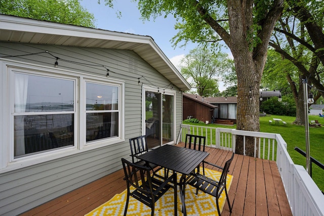 7315 120th St NW, Annandale, MN 55302 - wooden terrace with a yard and outdoor dining space