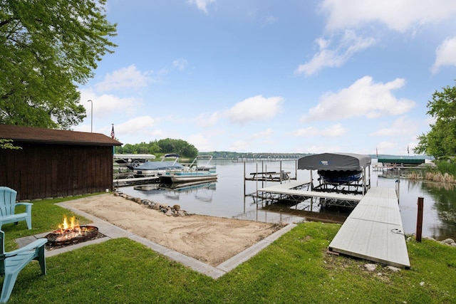 7315 120th St NW, Annandale, MN 55302 - dock featuring boat lift, an outdoor fire pit, a water view, and a yard