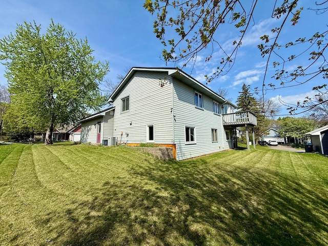 14303 Utica Ave, Savage, MN 55378 - view of property exterior featuring a lawn and a deck