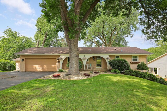 6788 147th St W, Savage, MN 55378 - ranch-style house featuring driveway, an attached garage, a front yard, and brick siding