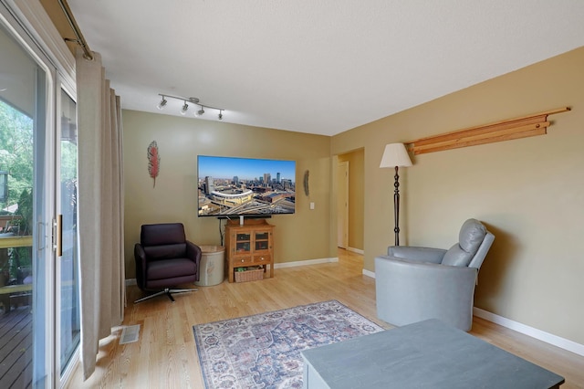 6788 147th St W, Savage, MN 55378 - living area with light wood-style floors and baseboards