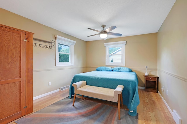 6788 147th St W, Savage, MN 55378 - bedroom featuring light wood-type flooring and ceiling fan