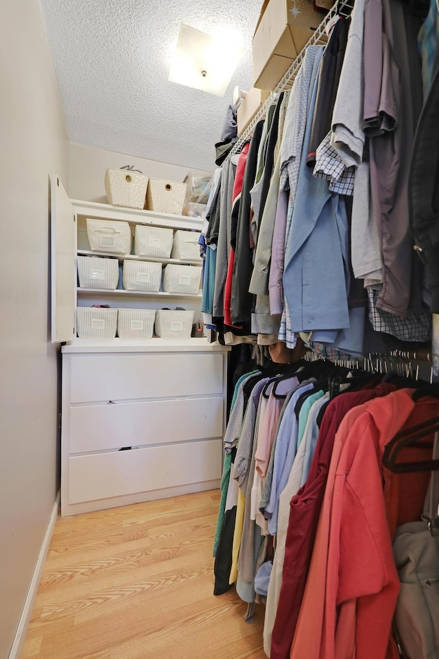 6788 147th St W, Savage, MN 55378 - spacious closet featuring wood finished floors