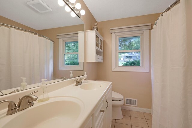 6788 147th St W, Savage, MN 55378 - bathroom featuring plenty of natural light, tile patterned floors, double vanity, and curtained shower