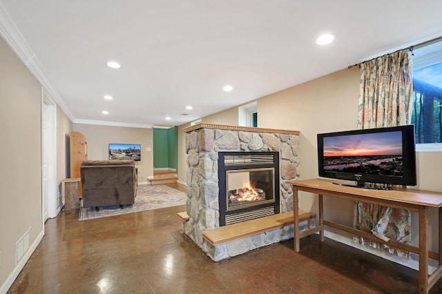6788 147th St W, Savage, MN 55378 - living area featuring a stone fireplace, concrete flooring, ornamental molding, and recessed lighting