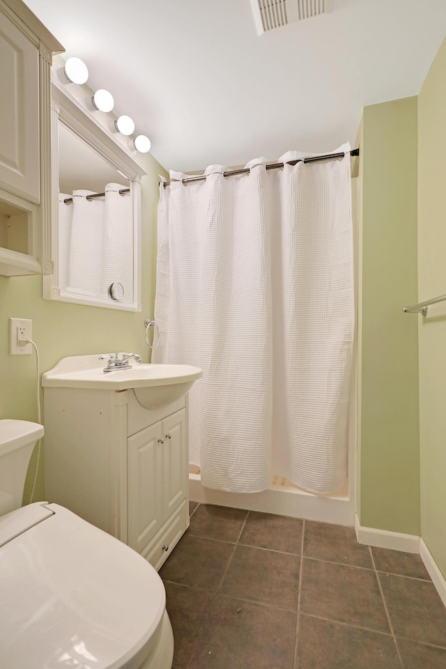 6788 147th St W, Savage, MN 55378 - bathroom featuring vanity, tile patterned floors, and a shower with shower curtain