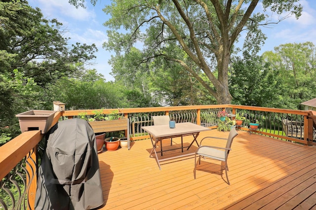 6788 147th St W, Savage, MN 55378 - wooden terrace featuring outdoor dining area and a grill