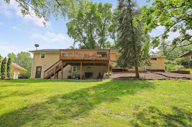 6788 147th St W, Savage, MN 55378 - back of property with a deck, stairway, and a yard