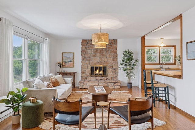 301 3rd St S Unit 302, Stillwater, MN 55082 - living room with wood finished floors and a stone fireplace
