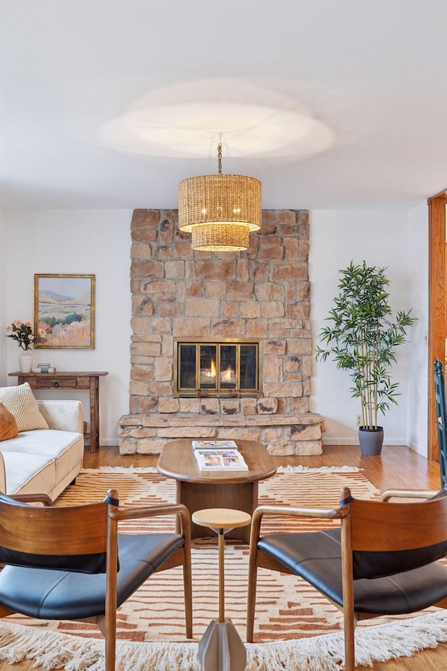 301 3rd St S Unit 302, Stillwater, MN 55082 - living area featuring wood finished floors and a stone fireplace