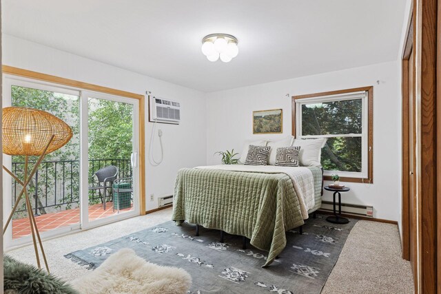 301 3rd St S Unit 302, Stillwater, MN 55082 - bedroom featuring access to outside, multiple windows, a baseboard heating unit, and a wall unit AC