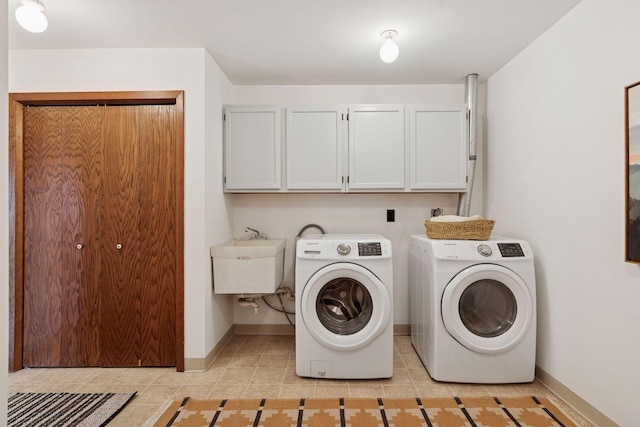 301 3rd St S Unit 302, Stillwater, MN 55082 - laundry area featuring cabinet space, independent washer and dryer, and light tile patterned flooring