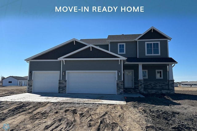 302 Neuman Blvd, Colfax, ND 58018 - craftsman house with stone siding and a garage