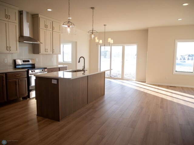 302 Neuman Blvd, Colfax, ND 58018 - kitchen featuring wall chimney exhaust hood, electric stove, wood finished floors, and recessed lighting