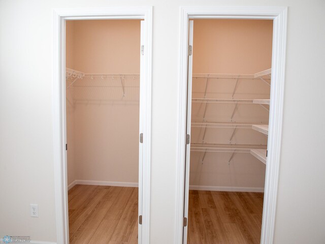 302 Neuman Blvd, Colfax, ND 58018 - walk in closet with light wood-style flooring